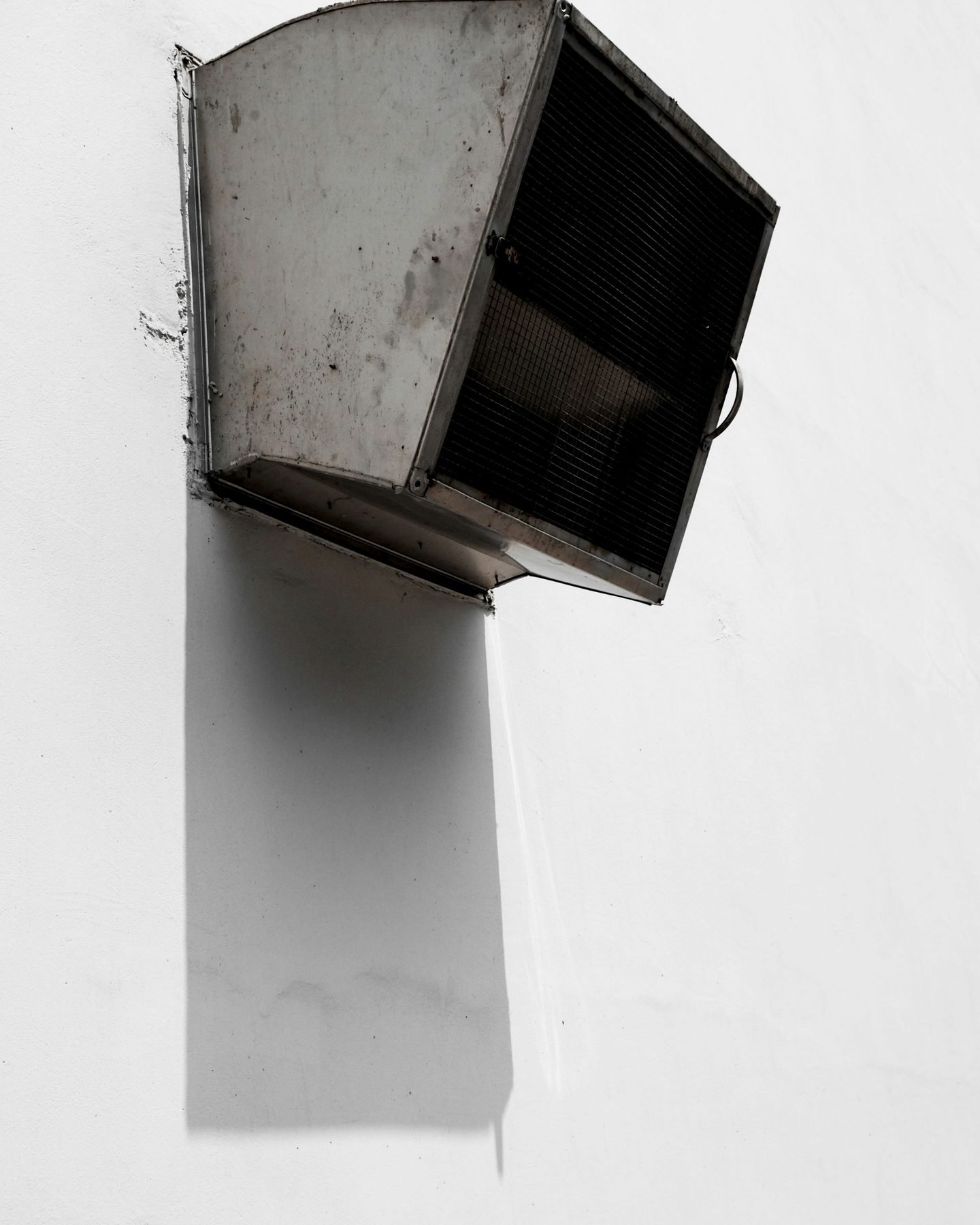 Metal air vent on a white wall